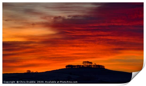 Minninglow with light from the rising sun (1) Print by Chris Drabble