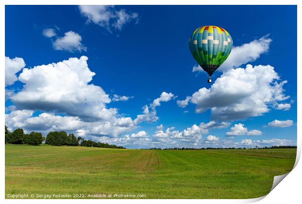 Colorful hot air balloons over green rice field. Print by Sergey Fedoskin