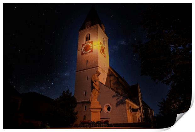A clock tower lit up at night. Spitz village. Wachau valley. Austria. Print by Sergey Fedoskin