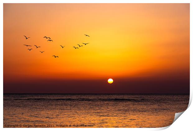 Bright sunset with a big yellow sun under the sea surface. Print by Sergey Fedoskin