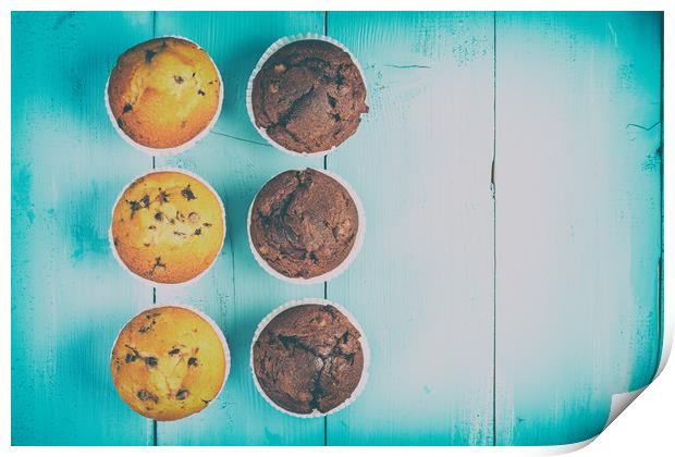 Homemade Chocolate Chip Muffins On Blue Table Print by Radu Bercan