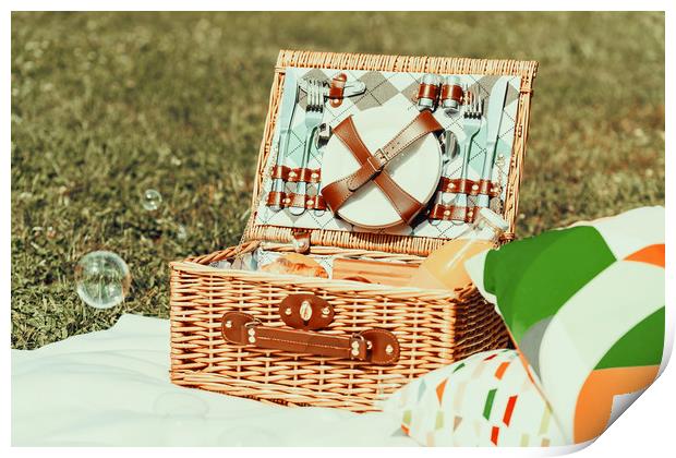 Picnic Basket Food On White Blanket With Pillows A Print by Radu Bercan