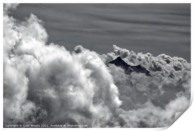 An alpine peak emerges from the clouds Print by Colin Woods