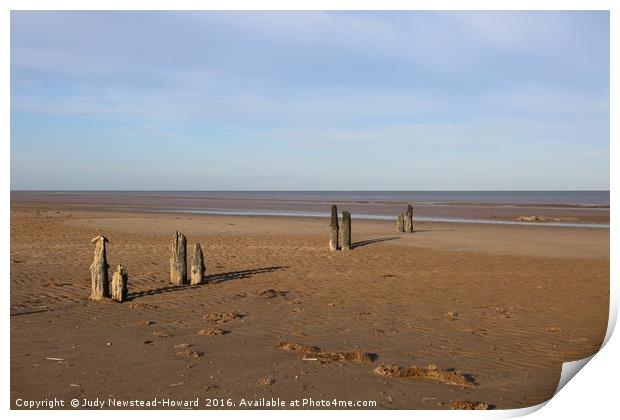Wooden Posts, Titchwell beach, Norfolk Print by Judy Newstead-Howard