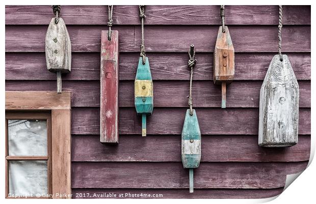 Fishing floats hanging on a wooden wall Print by Gary Parker