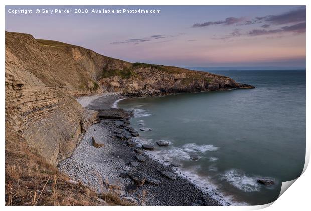 Pebble beach and cliffs at sunset Print by Gary Parker
