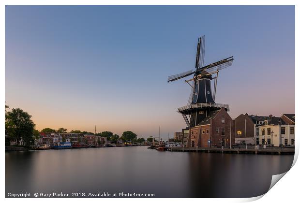 Dutch windmill, in the town of Haarlem, at sunset. Print by Gary Parker