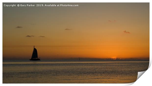 A sailboat , sailing past a tropical sunset	  Print by Gary Parker