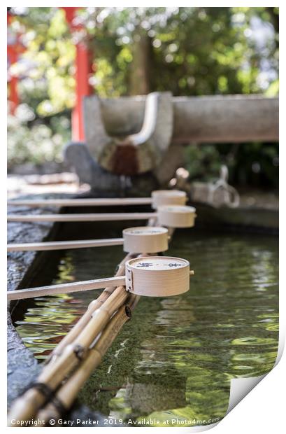 Row of ceremonial water cups at Japanese temple Print by Gary Parker