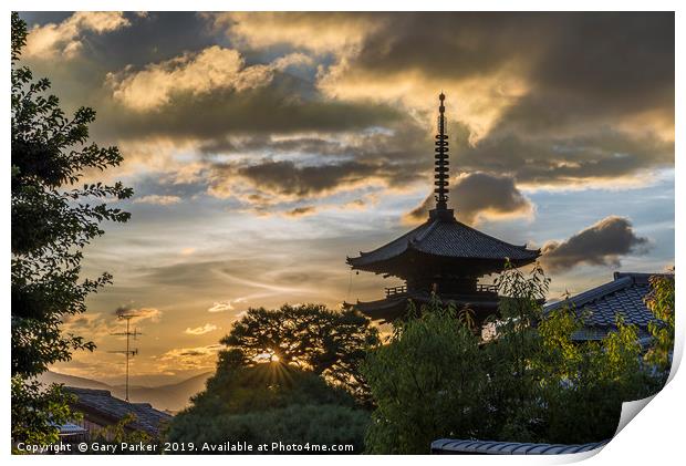 A Japanese pagoda, in Kyoto, framed by a sunset Print by Gary Parker