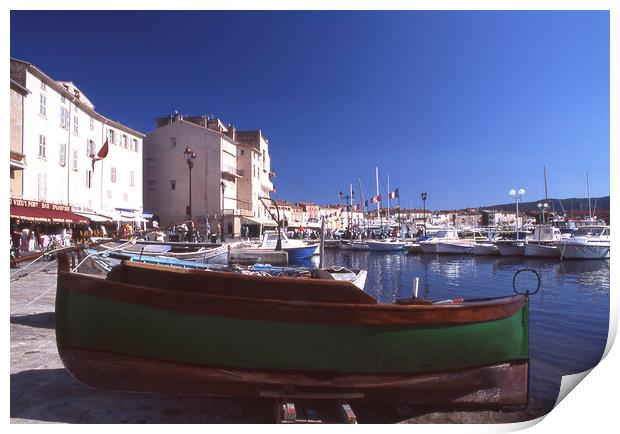 Green boat under dramatic sunny noon in St. Tropez Print by Alfredo Bustos