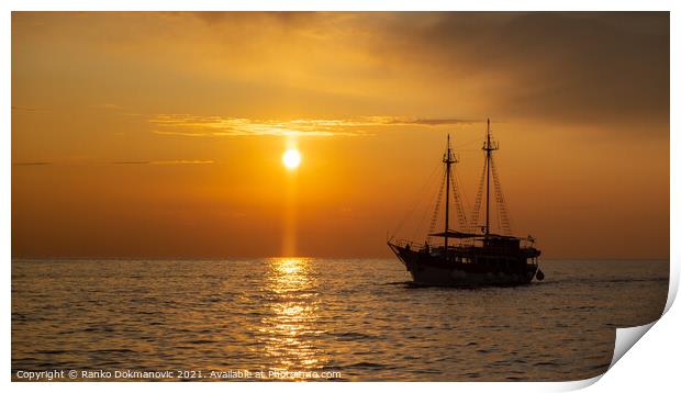 Sailing boat at sunset Print by Ranko Dokmanovic