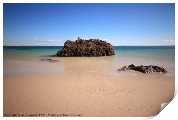 Sandy Beach with turquoise sea water with rocks. l Print by nuno valadas