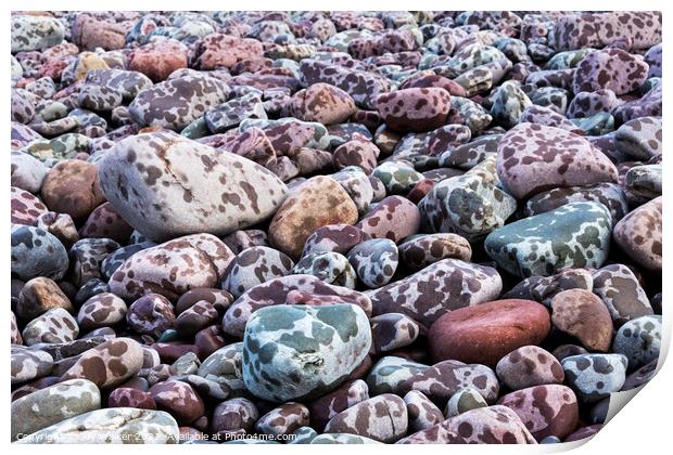 Pebbles on the seashore during a rain storm Print by Joy Walker