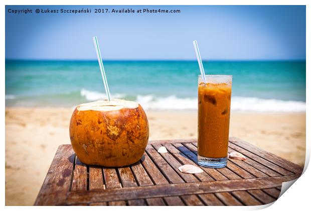 Coconut drink and ice coffee on the wooden table Print by Łukasz Szczepański