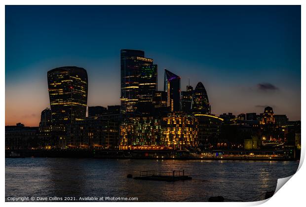 City of London Financial District buildings illuminated at dusk from the south bank walkway by Tower Bridge in London, UK Print by Dave Collins