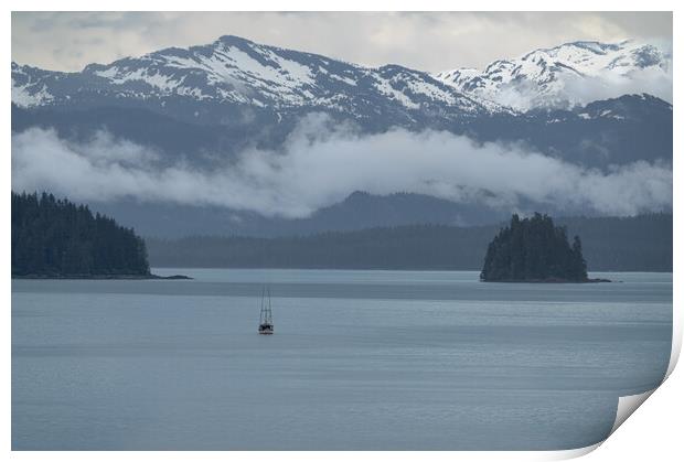 Commercial fishing boat  in Frederick Sound near Petersburg with clouds around the mountains beyond, Alaska, USA Print by Dave Collins