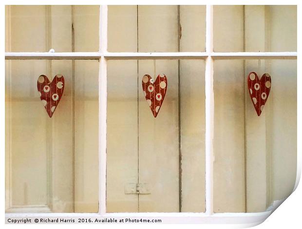 Decorative hearts displayed inside shuttered windo Print by Richard Harris