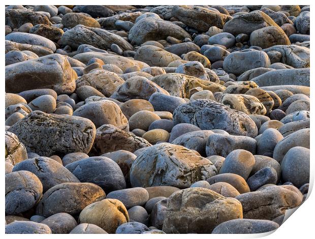 Sunset Glow on Pebbles Print by Colin Allen