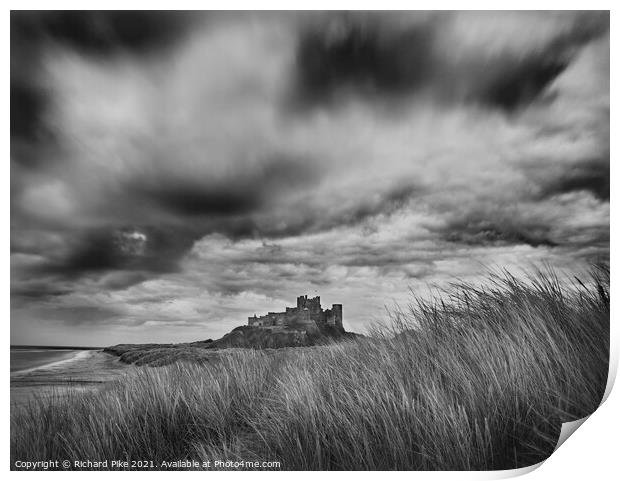 Gathering storm over Bamburgh Castle Print by Richard Pike