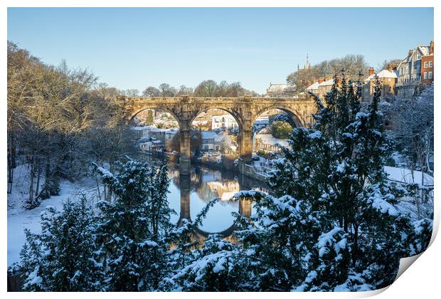 Winter snow sunrise over the railway viaduct and river Nidd in Knaresborough, North Yorkshire.  Print by mike morley