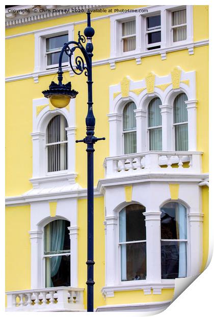 Vintage Lamp Post and Colourful Building in Llandu Print by Chris Dorney