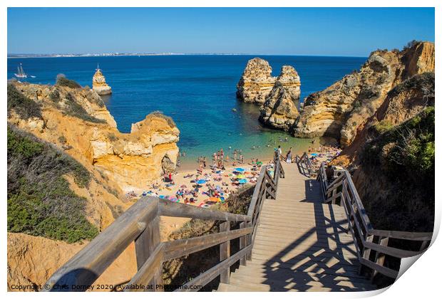 Praia do Camilo in Portugal Print by Chris Dorney