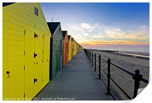 Beach Huts As The Sun Sets.. Print by Jon Wood