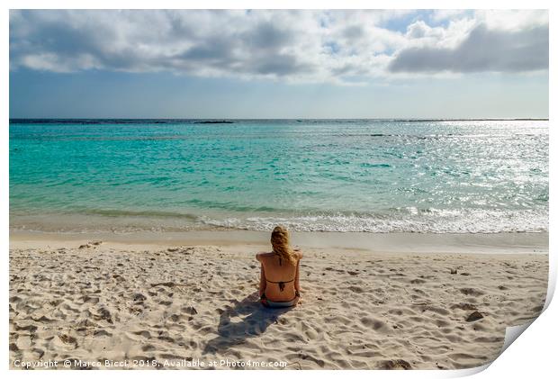 Woman relax in front of the Caribbean Sea in Aruba Print by Marco Bicci