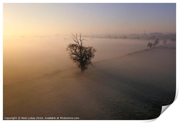 A sunrise over misty fields derbyshire Print by Nick Lukey