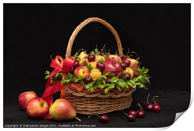 Basket with fresh fruits and berries on a black background Print by Dobrydnev Sergei