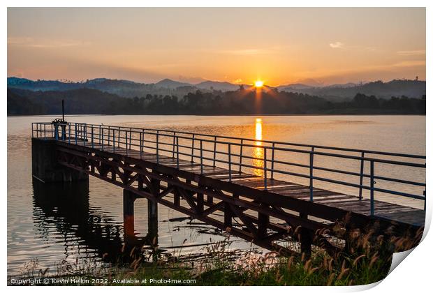 sunrise over the pier Print by Kevin Hellon