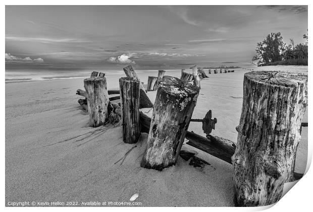 Posts in the sand Print by Kevin Hellon