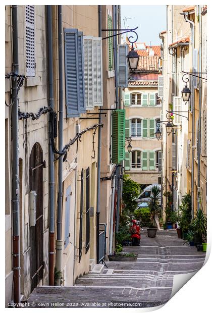 Steep, narrow street in old Marseille, France Print by Kevin Hellon