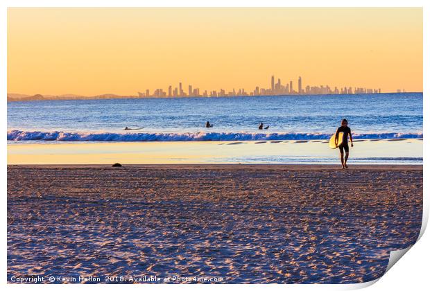 Surfer walks away from the sea  Print by Kevin Hellon