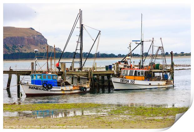  Fishing boats moored at a pier Print by Kevin Hellon