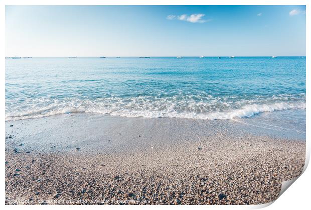 Pebble beach in Condofuri Calabria Italy with fishing boats on the horizon Print by Natalia Macheda