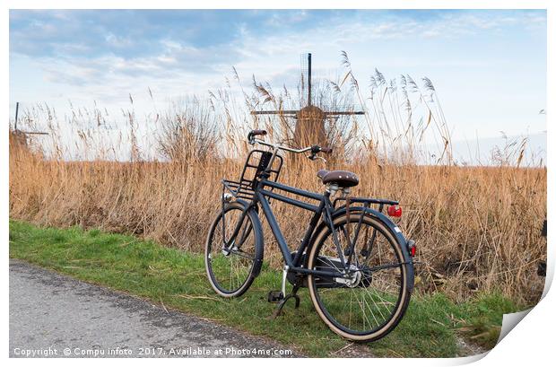 old type of bike and windmill Print by Chris Willemsen