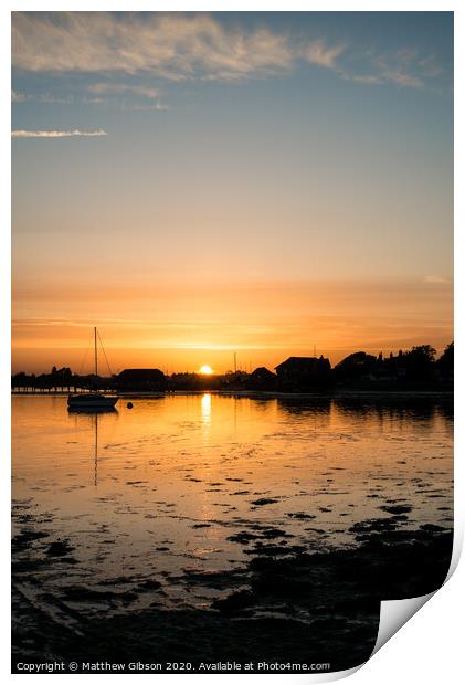 Beautiful Summer sunset landscape over low tide harbor with moored boats Print by Matthew Gibson