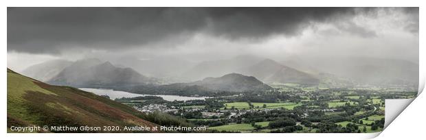 Stunning epic landscape image across Derwentwater valley with falling rain drifting across the mountains causing pokcets of light and dark across the countryside Print by Matthew Gibson