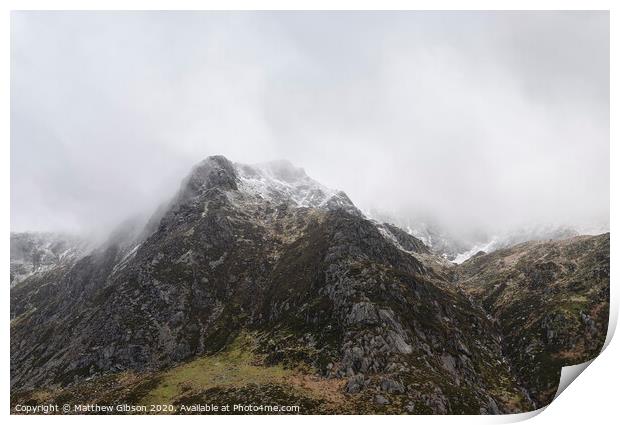Stunning moody dramatic Winter landscape image of snowcapped Y Garn mountain in Snowdonia Print by Matthew Gibson
