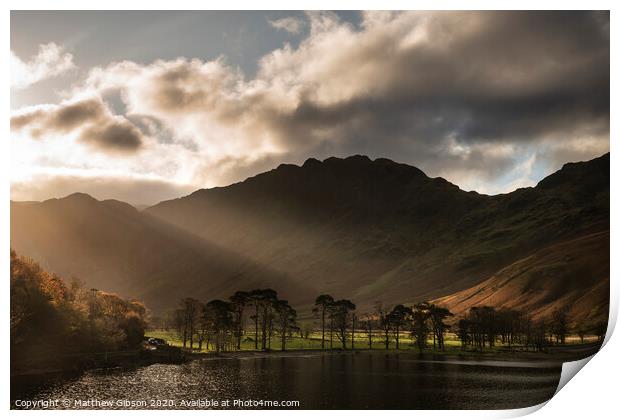 Majestic vibrant Autumn Fall landscape Buttermere in Lake District with beautiful early morning sunlight playing across the hills and mountains Print by Matthew Gibson