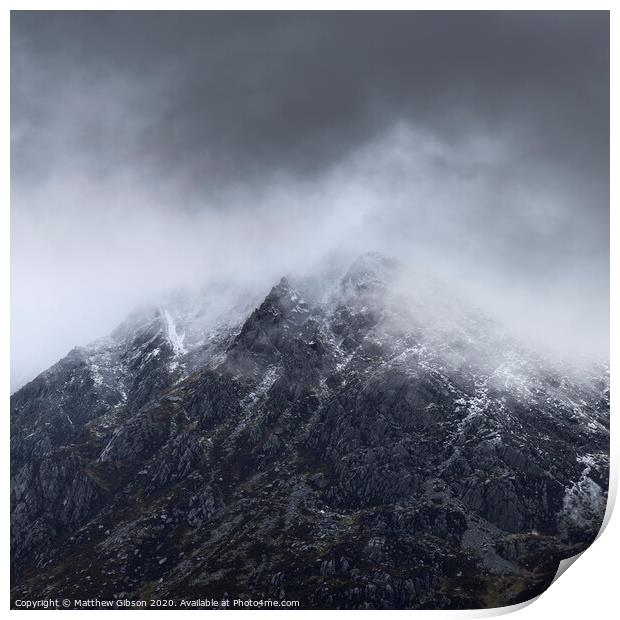 Stunning detail landscape images of snowcapped Pen Yr Ole Wen mountain in Snowdonia during dramatic moody Winter storm Print by Matthew Gibson