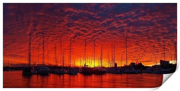 Vibrant red colored cloudy sunset seascape.   Print by Geoff Childs