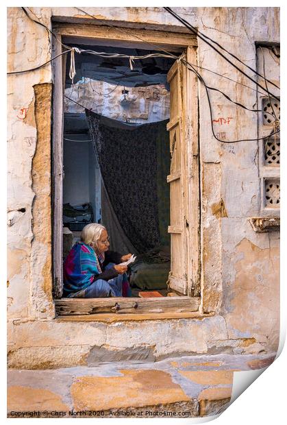 Lady reading letter in doorway, Jaisalmer Fort. Print by Chris North