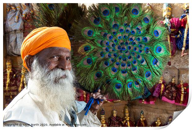 Peacock fan Seller at Jaisalmer Fort, India. Print by Chris North