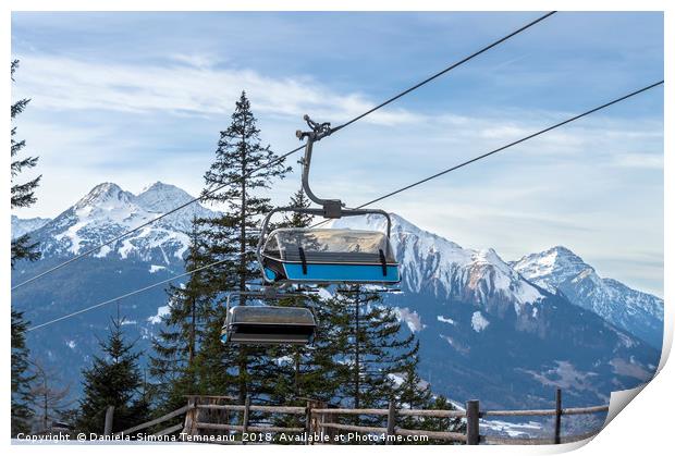 Ski lift with the snowy mountain in the background Print by Daniela Simona Temneanu