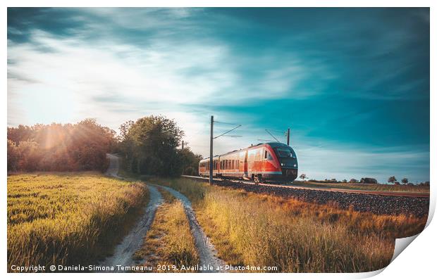 High-speed train moving through nature at sunset Print by Daniela Simona Temneanu