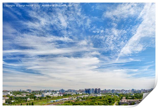 Panorama of the city under a high beautiful blue sky with light white curly clouds. Print by Sergii Petruk