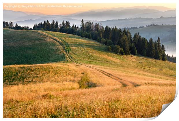 Morning landscapes of the mountainous Carpathians, sunrise illuminates the rural road that runs along the ridge of the hill. Print by Sergii Petruk